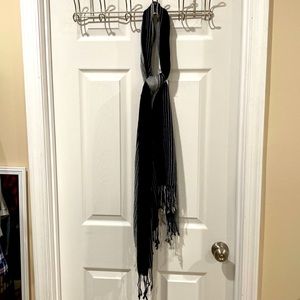 Black white and gray striped scarf with fringe on the ends